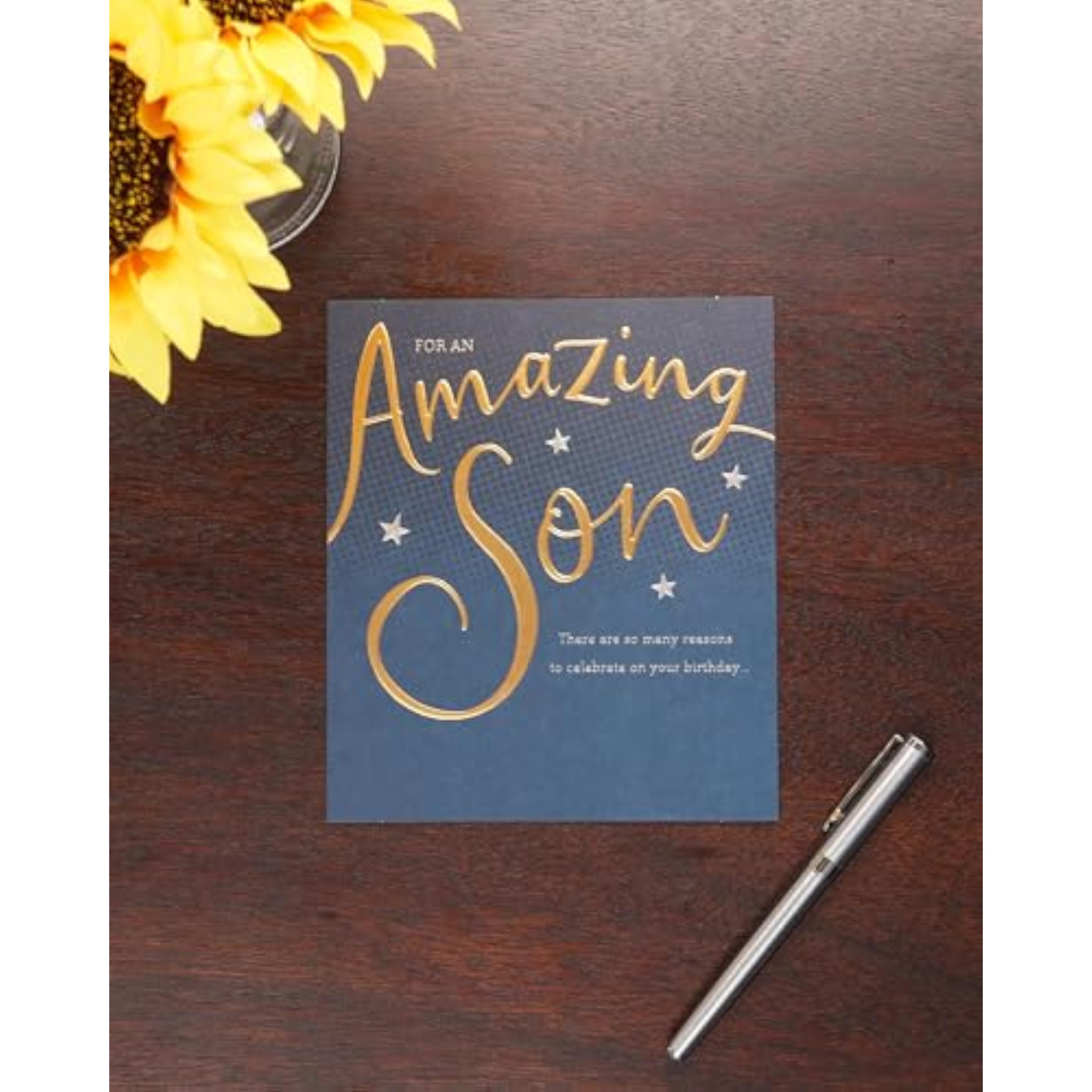 Son birthday greeting card by UKG with gold and blue proud design, featuring celebratory artwork and heartfelt message.