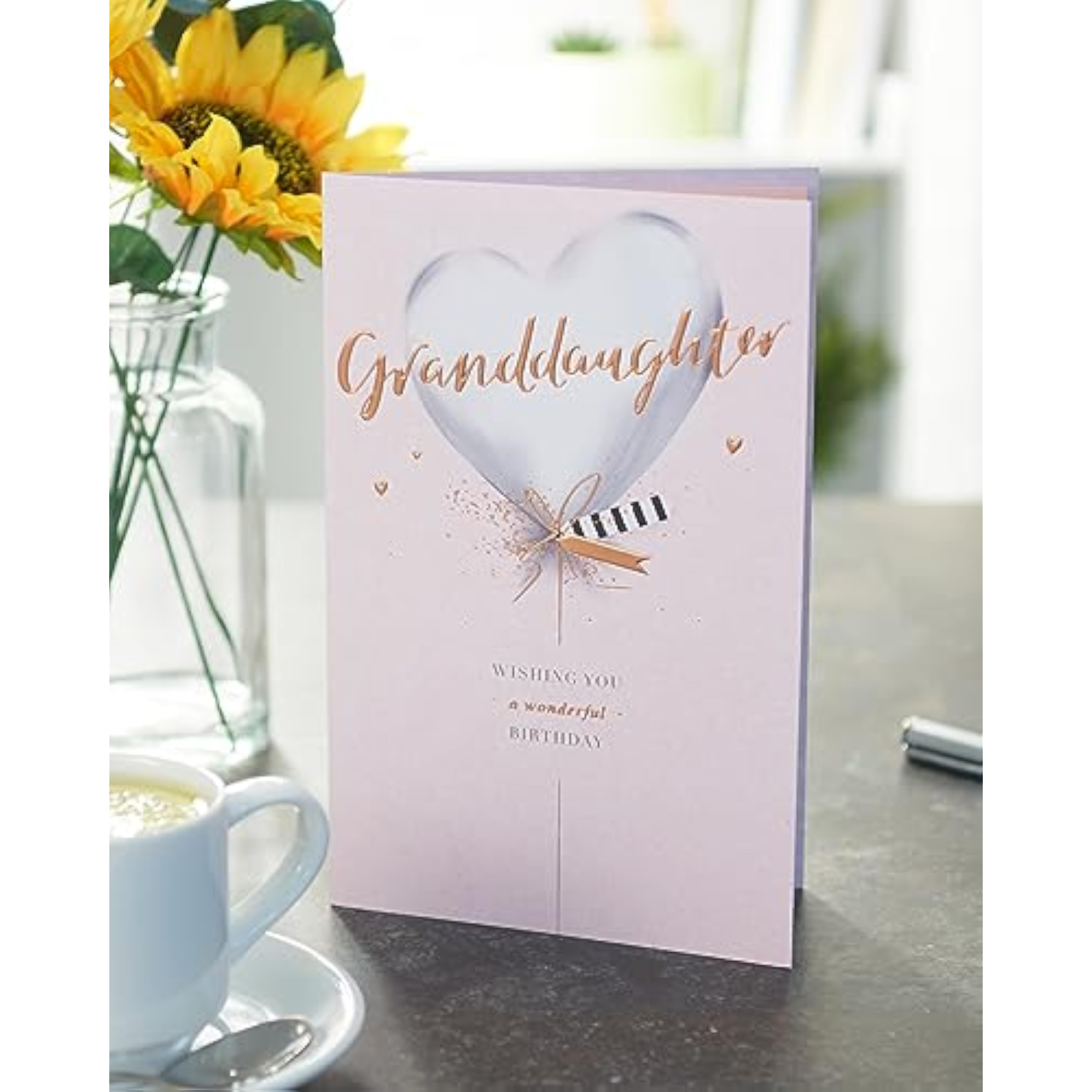 UKG birthday greeting card for granddaughter with silver balloon design, featuring colorful balloons and festive lettering.