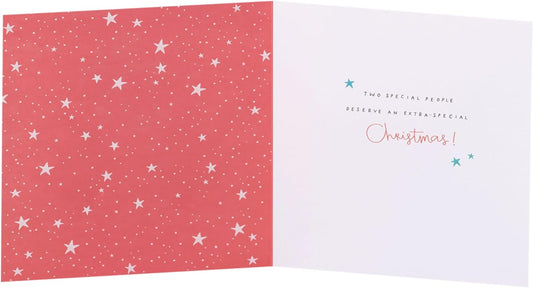 UKG Christmas greeting card featuring ice skating penguins, designed for sister and brother-in-law, with festive holiday imagery.