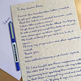 Three uni-ball EYE UB-150 blue micro rollerball pens with 0.5mm tips, showing the pens' blue ink and sleek design.