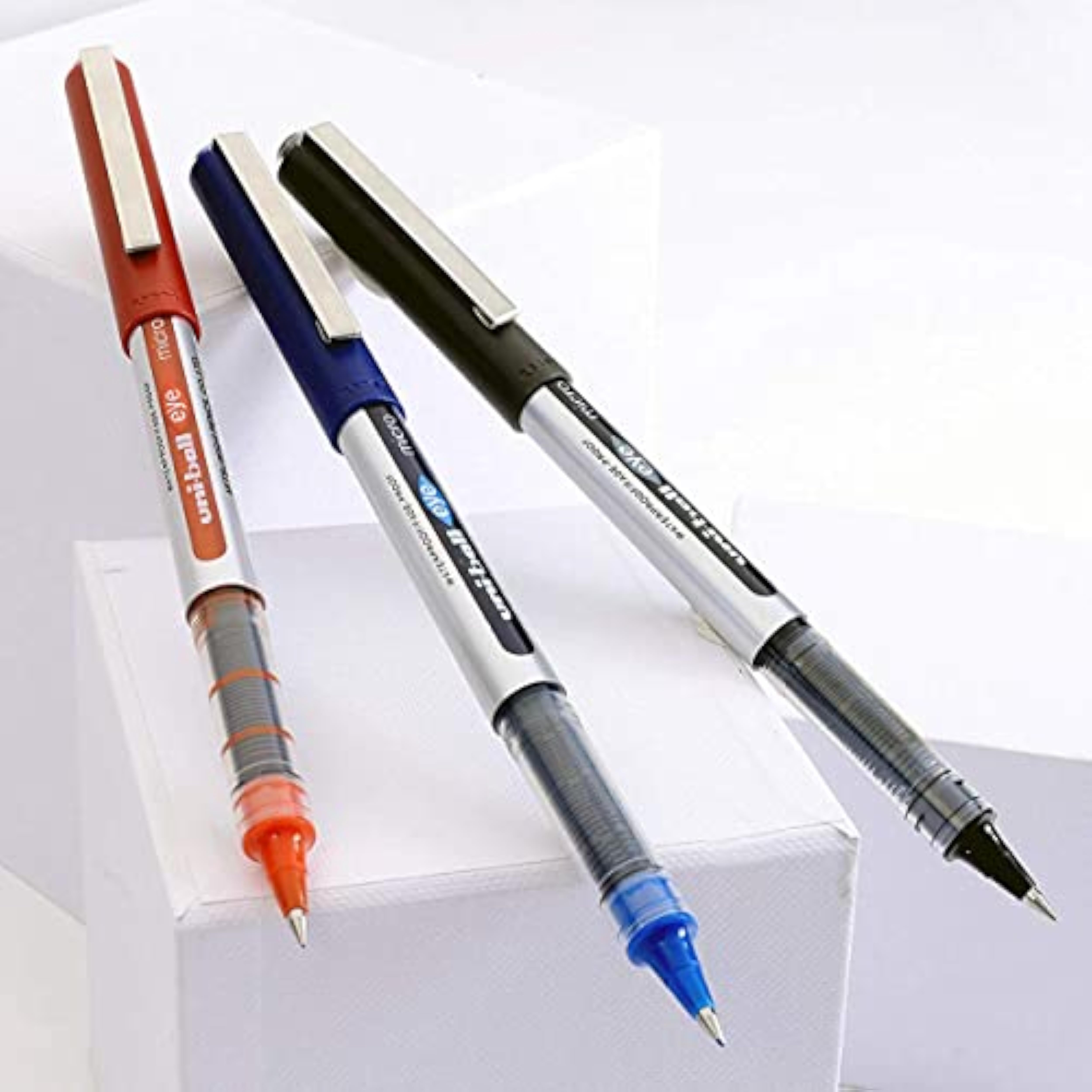 Set of three uni-ball EYE UB-150 blue micro 0.5mm rollerball pens, featuring sleek design and smooth writing tips.