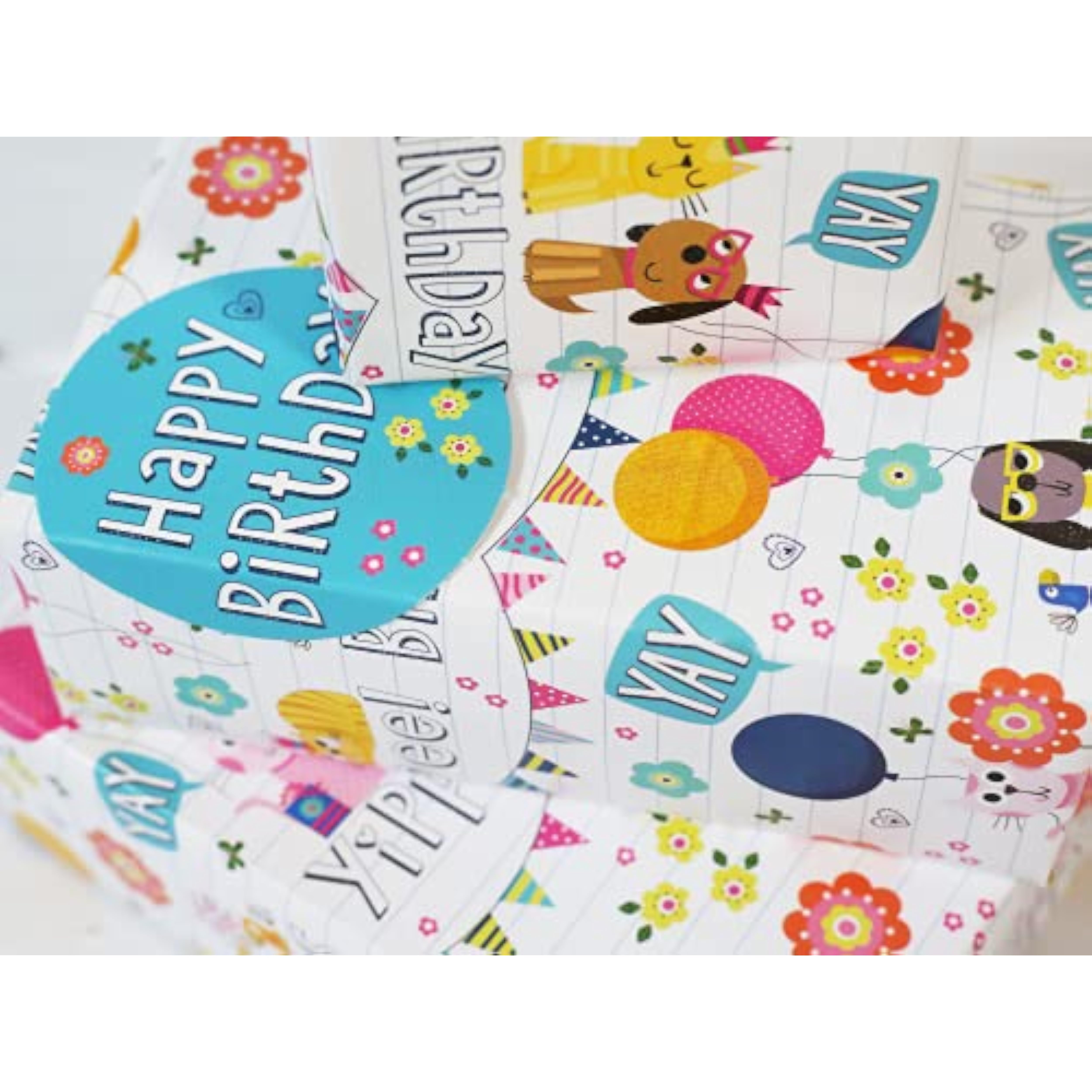 Birthday Pets gift wrap with matching tags, featuring colorful pet-themed designs on two sheets, by Abacus Cards.