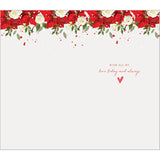 Elegant handcrafted Christmas greeting card featuring a festive figure holding a holiday message, by Abacus Cards.