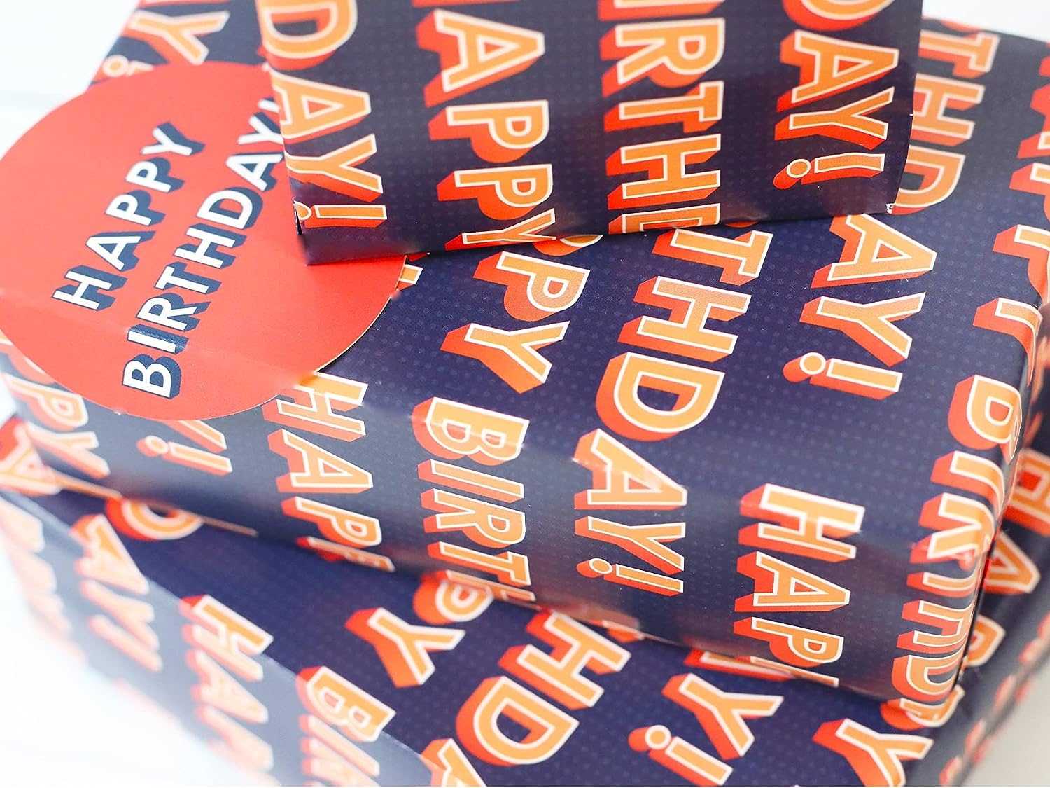 Happy birthday gift wrap with two sheets and tags by Abacus Cards, featuring colorful birthday-themed designs.