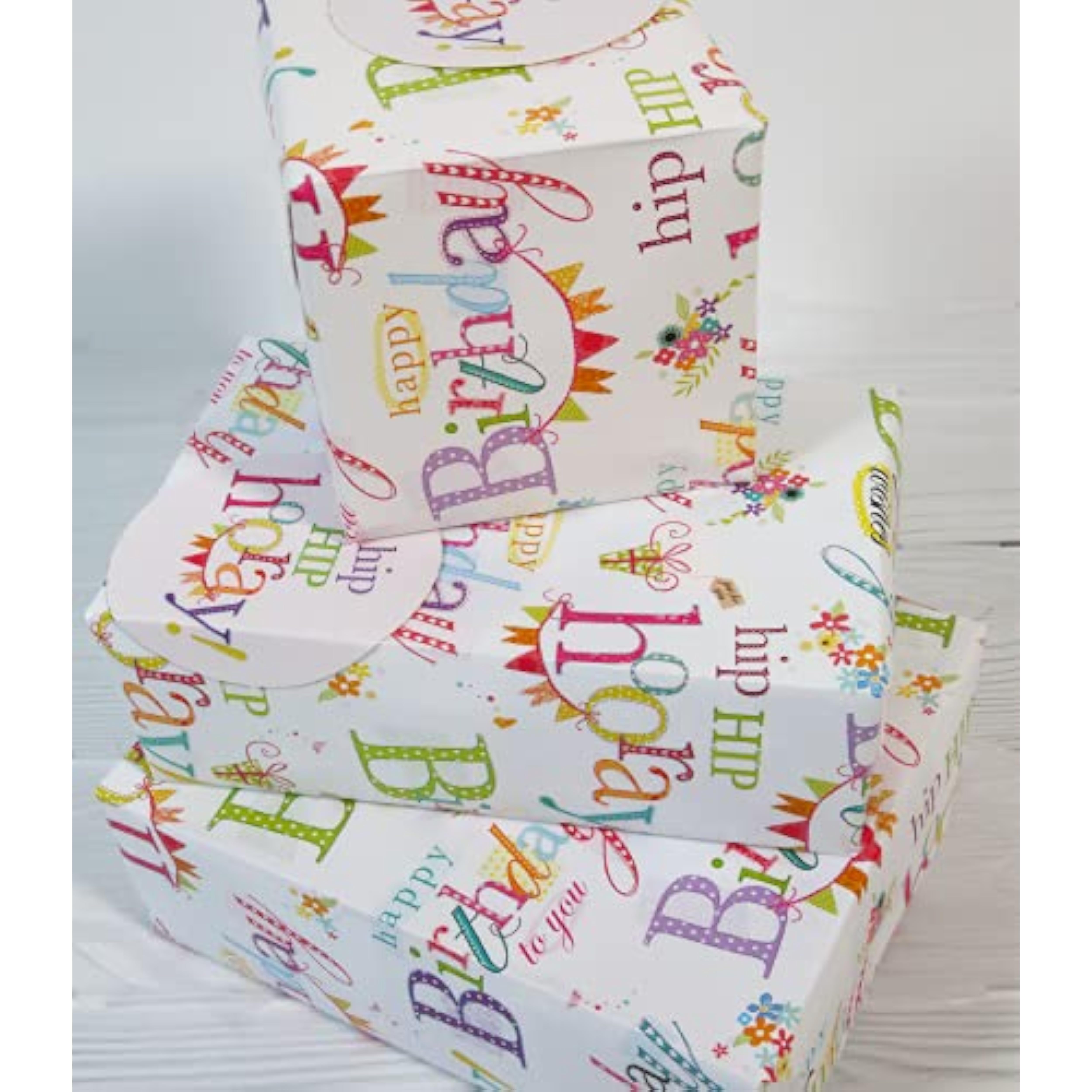 Colorful Happy Birthday greeting card with matching gift wrap and tags from Abacus Cards, featuring cheerful birthday text and designs.