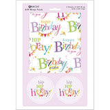 Happy Birthday greeting card with colorful text gift wrap and matching tags, designed by Abacus Cards.