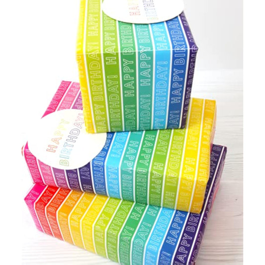 Colorful rainbow stripe gift wrap set featuring matching greeting cards by Abacus Cards, ideal for special occasions and celebrations.
