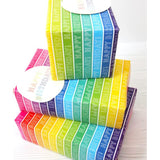 Colorful rainbow stripe gift wrap set featuring matching greeting cards by Abacus Cards, ideal for special occasions and celebrations.
