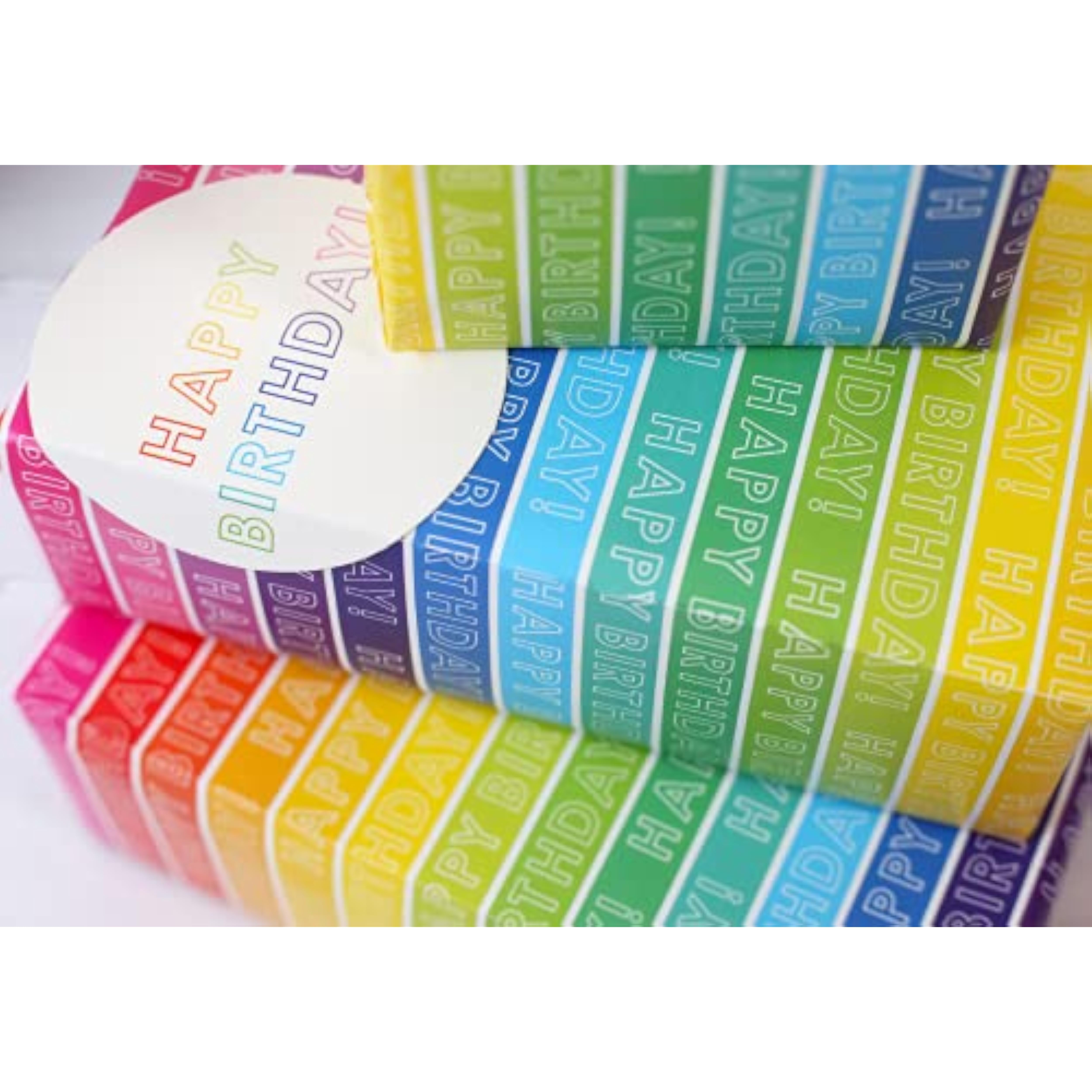 Rainbow stripe gift wrap set featuring colorful wrapping paper and matching greeting cards from Abacus Cards.