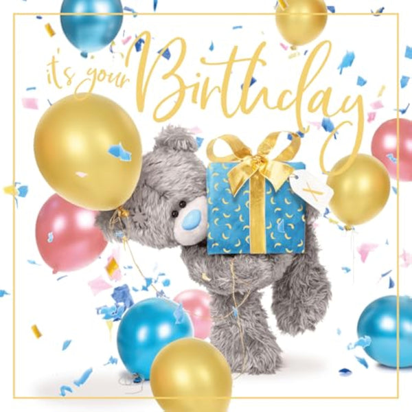 Cute Carte Blanche bear holding a present, featuring a plush design and festive holiday theme.
