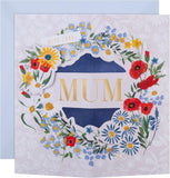 Hallmark Pop-Up 3D flower wreath Mother’s Day card with vibrant floral design and elegant greeting inside.