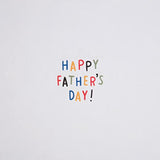 Hallmark Father's Day greeting card with a badge attachment, featuring colorful design and heartfelt message inside.
