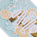 Hallmark anniversary greeting card with traditional floral and "Both of You" text design, featuring elegant floral illustrations.