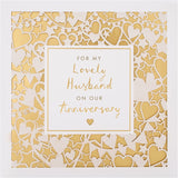 Gold laser-cut Hallmark greeting card for husband anniversary with intricate design and heartfelt message inside.