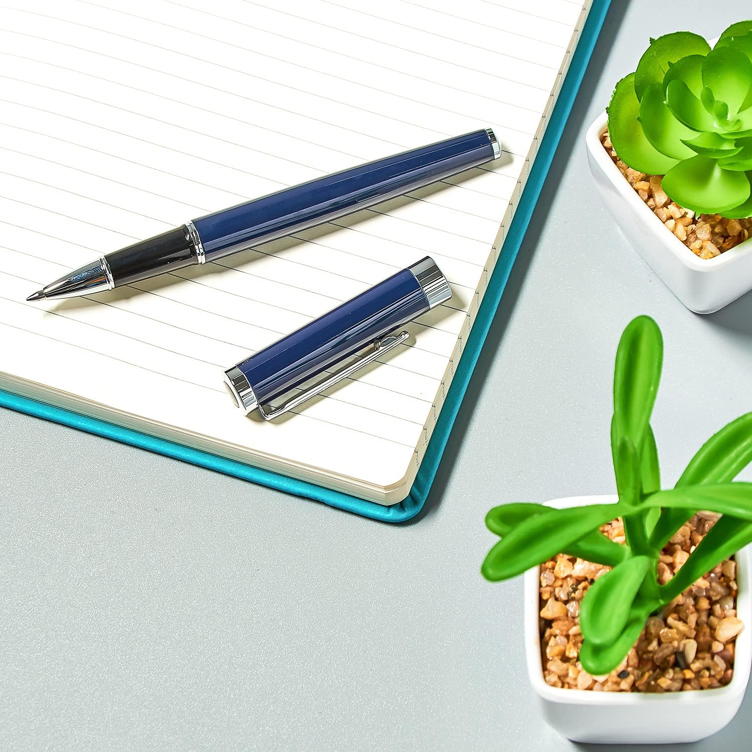 Helix Oxford Premium rollerball pen with blue ink, sleek design, shown with plastic-free packaging.