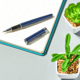 Helix Oxford Premium rollerball pen with blue ink, sleek design, shown with plastic-free packaging.