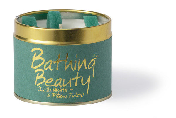 Lily-Flame Bathing Beauty scented tin candle with floral design and a warm, inviting glow.