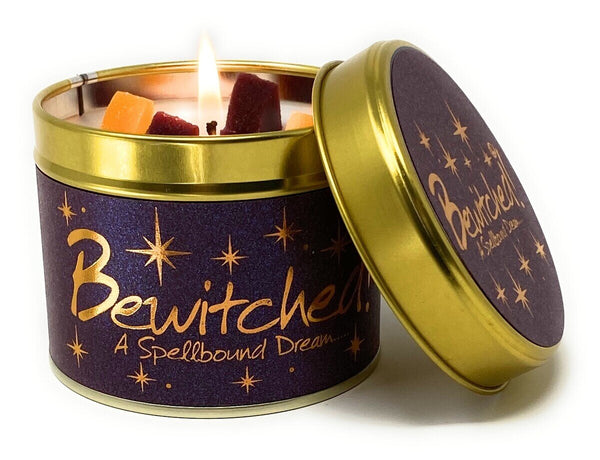 Lily-Flame Bewitched scented tin candle with black and purple label, featuring mystical design and a wax candle inside.