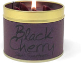Black Cherry scented tin candle by Lily-Flame, showing a round metal tin with a cherry illustration and a lit wick inside.