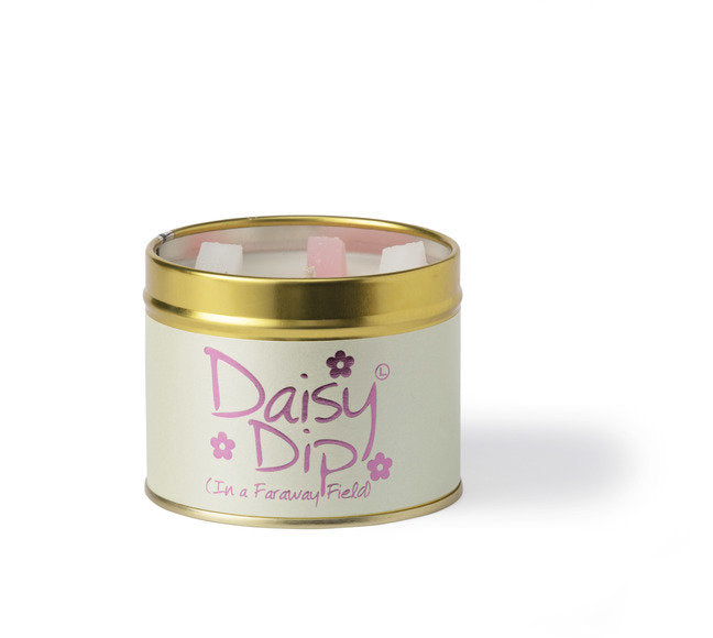 Daisy Dip scented tin candle by Lily-Flame with a decorative floral label and a lit wick, emitting a warm glow.