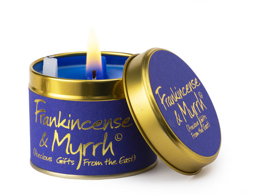 Lily-Flame scented tin candle with frankincense and myrrh aroma, featuring a decorative label and a metal lid.