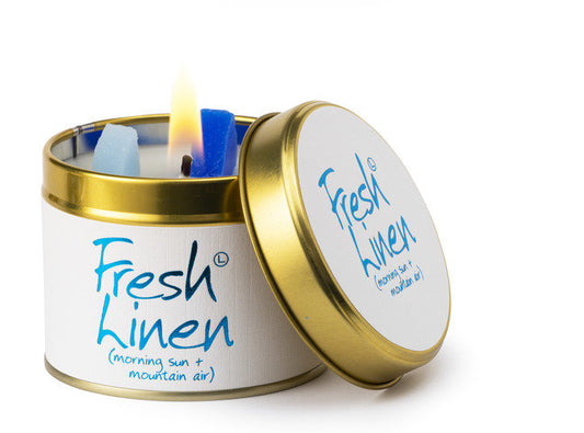 Lily-Flame Fresh Linen scented tin candle with a white label and metal lid, perfect for home decor and relaxing aromas.