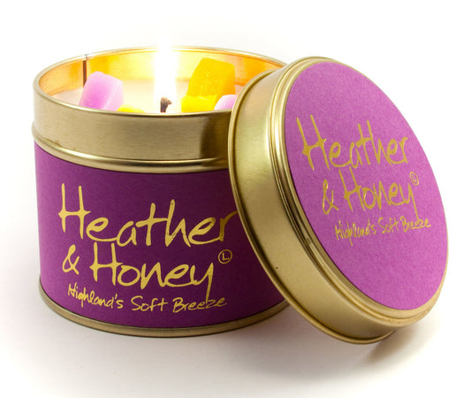 Heather and Honey scented tin candle by Lily-Flame with a decorative label and warm, inviting design.