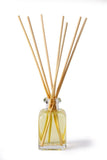 Lily-Flame reed diffuser refills with natural reed sticks for aromatic home fragrance, arranged in a clear container.