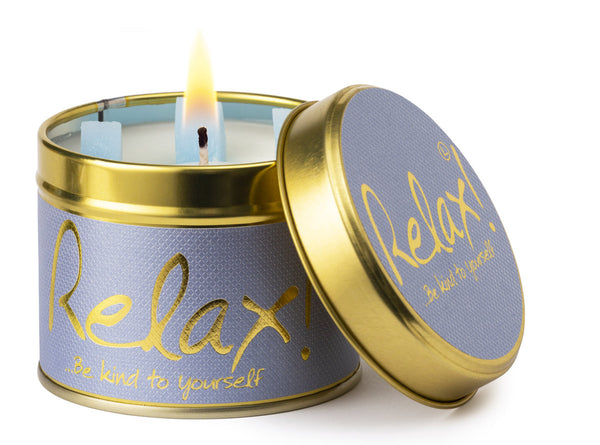 Lily-Flame Relax scented tin candle with a decorative label, designed for soothing ambiance and aromatic comfort.