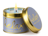 Lily-Flame Relax scented tin candle with a decorative label, designed for soothing ambiance and aromatic comfort.