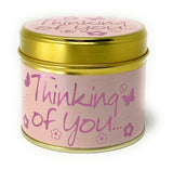 Lily-Flame Thinking of You scented tin candle with floral design, small metal container, and warm candle flame.