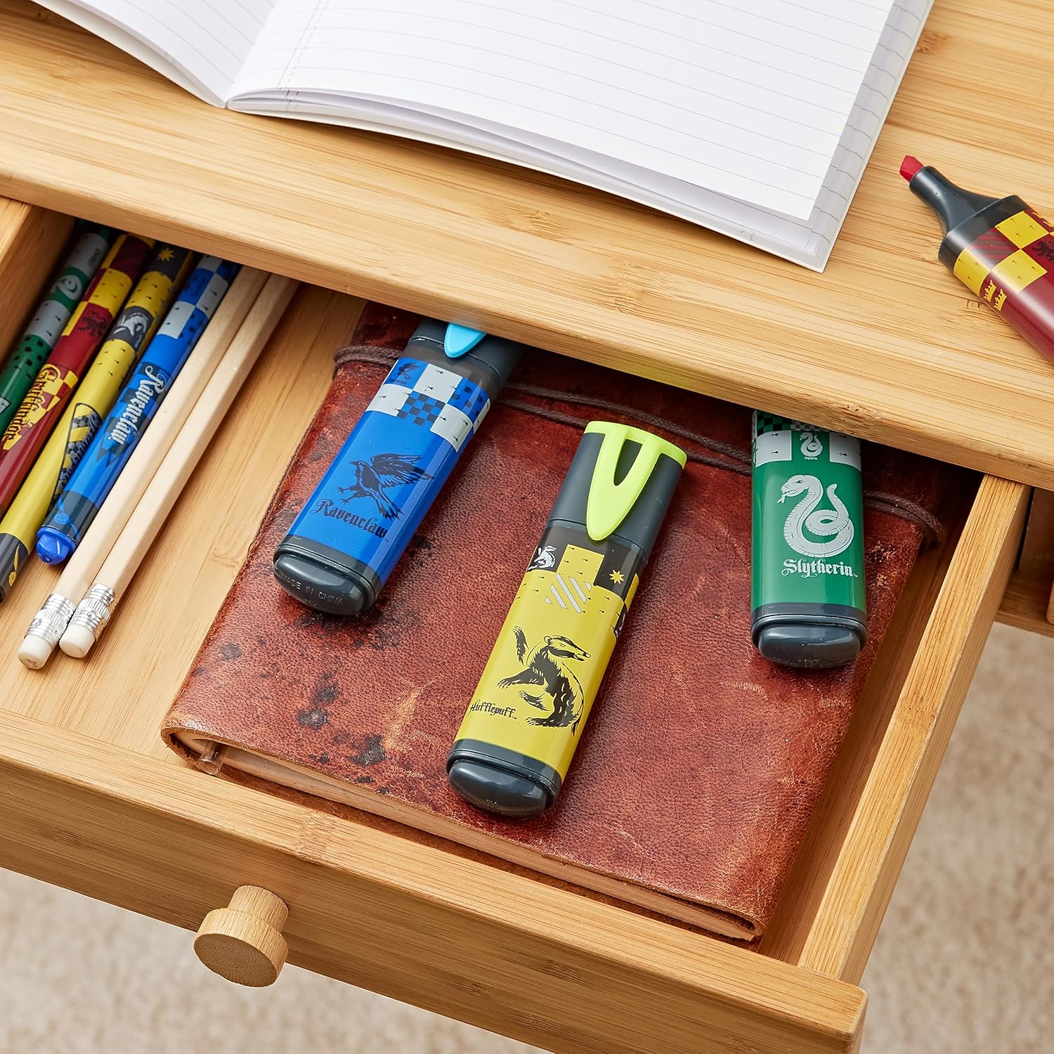Set of four Maped Harry Potter highlighters with colorful ink tips and Harry Potter-themed packaging.