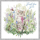 Grey tabby cat in a meadow on a silver foil birthday greeting card by NQ, showcasing a charming feline scene.