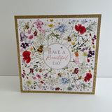 Gold foil Wildflower Bloom birthday greeting card by NQ with colorful floral design and elegant lettering.