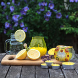 Set of 25 Price's Candle citronella tealights in small containers, ideal for outdoor insect repellent and ambient lighting.