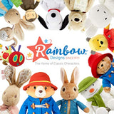 Rainbow Designs Peter Rabbit soft toy attached to a stroller, colorful and plush, perfect for babies and toddlers as a pram toy.