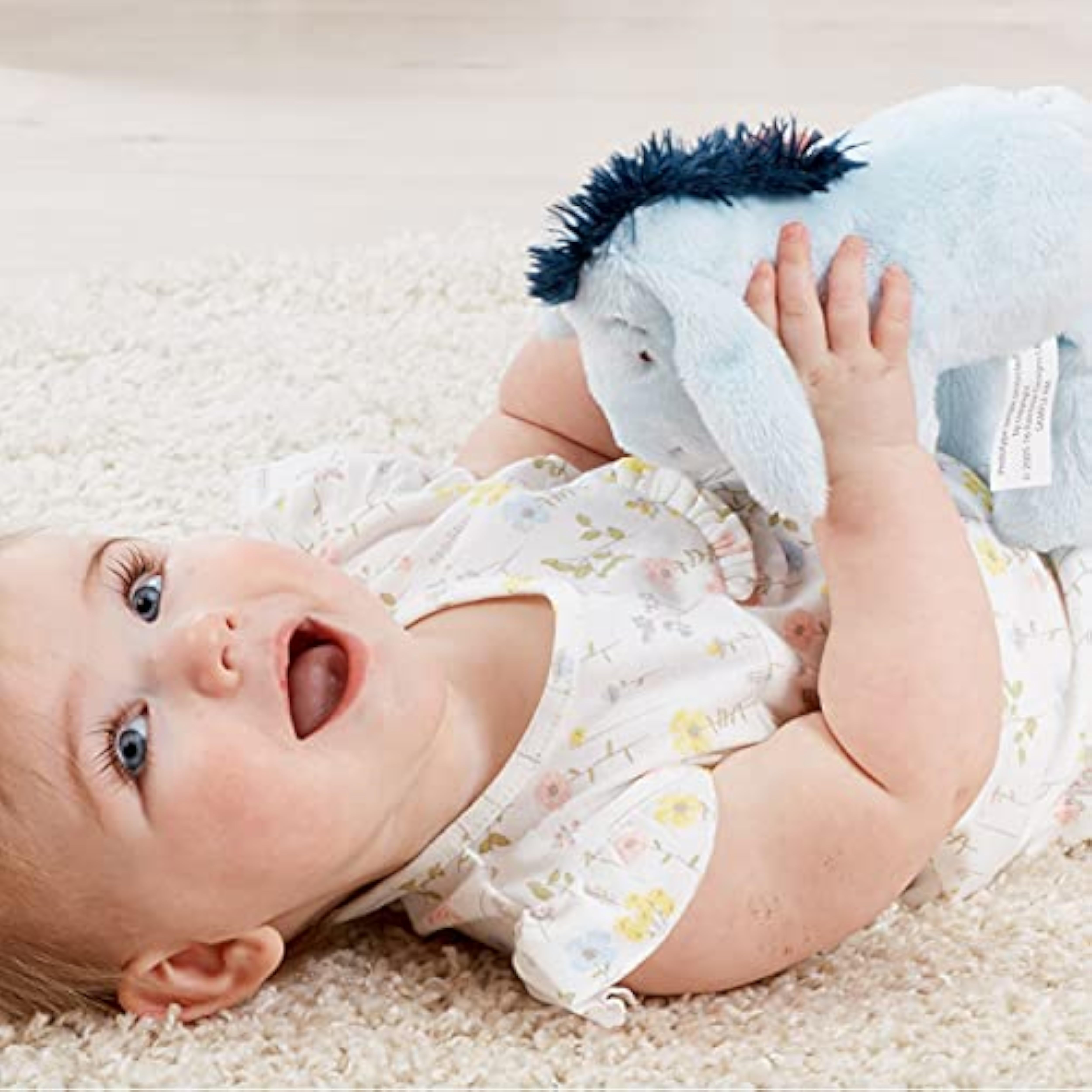 Soft plush Eeyore toy from Rainbow Designs featuring cuddly donkey plush for newborns, children, and toddlers.