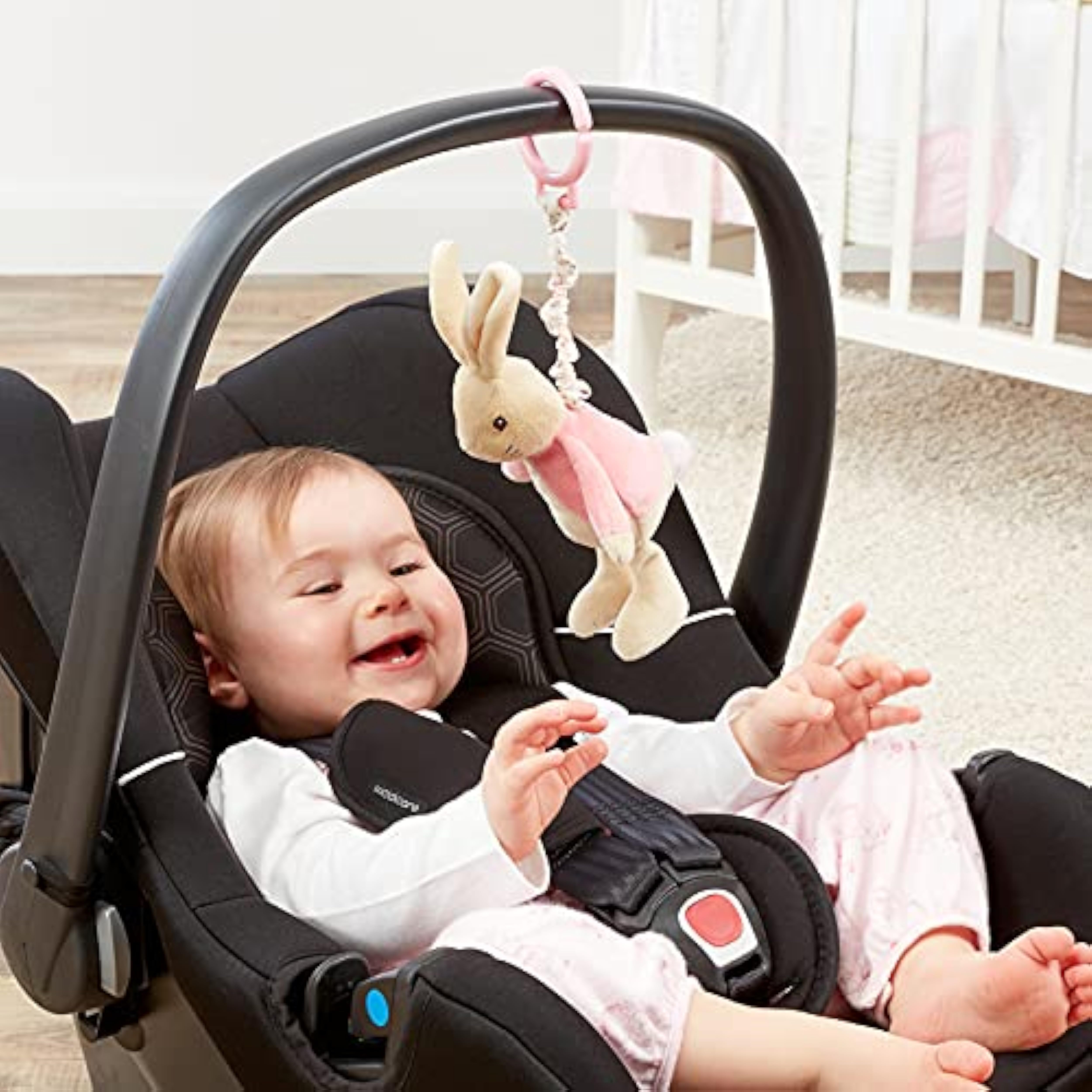 Pink Beatrix Potter Flopsy Jiggle Attachable Peter Rabbit pram toy from Rainbow Designs, featuring a soft, plush Peter Rabbit figure.