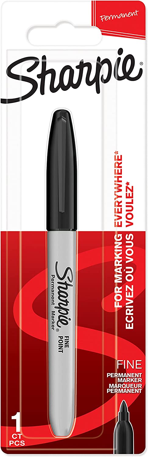 Sharpie black permanent marker fine point used for decorating greeting cards, with the marker cap and tip visible.