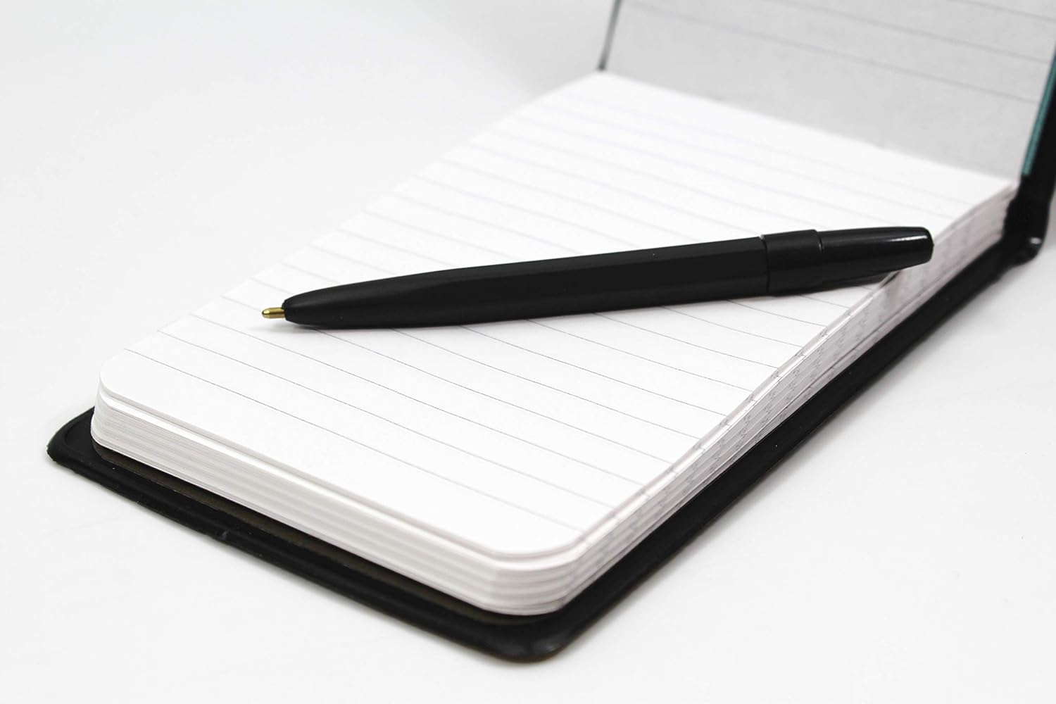 Silvine elasticated pocket notebook with 80 pages, durable PVC covers, and a pen for convenient note-taking.