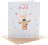 Cute Boofle birthday card for sister featuring adorable design, from UK Greetings, with colorful illustrations and cheerful message.