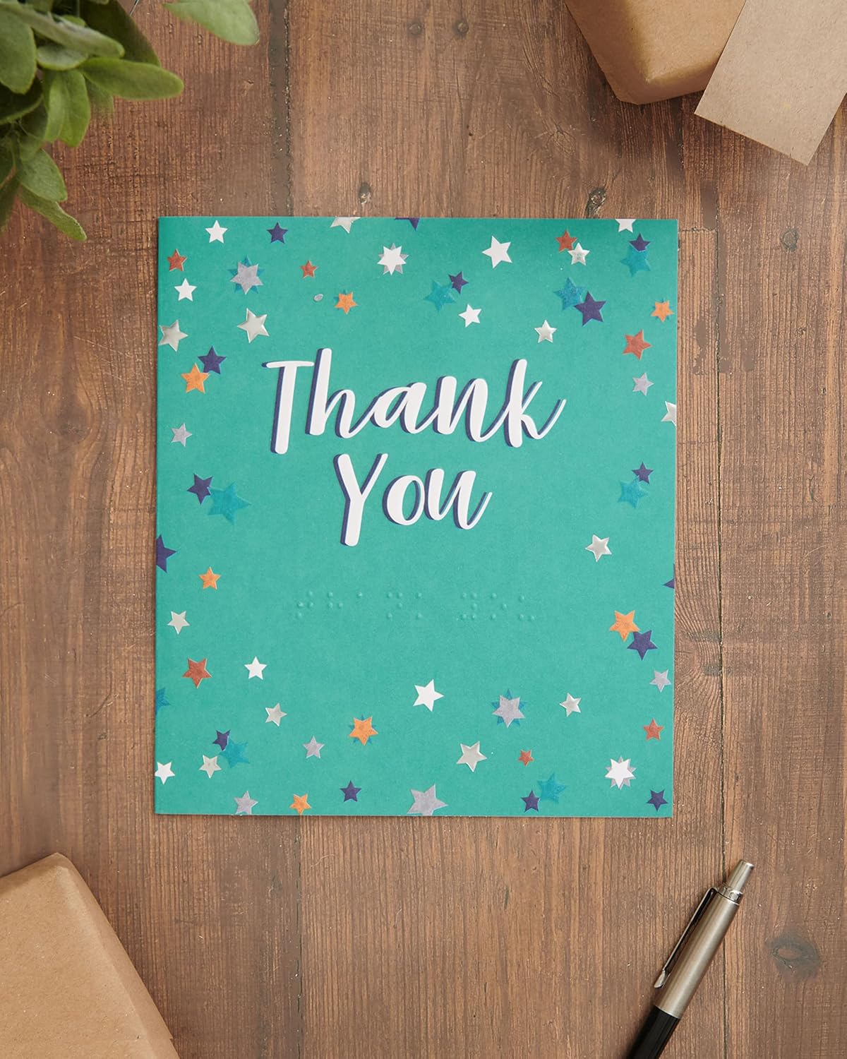 UK Greetings star-themed braille thank you card featuring a lovely design with stars and tactile elements.