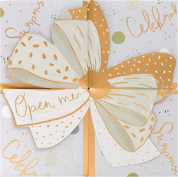 Luxury pop-up money wallet gift card holder with elegant gold bow design, UK Greetings product, featuring a stylish and functional accessory.