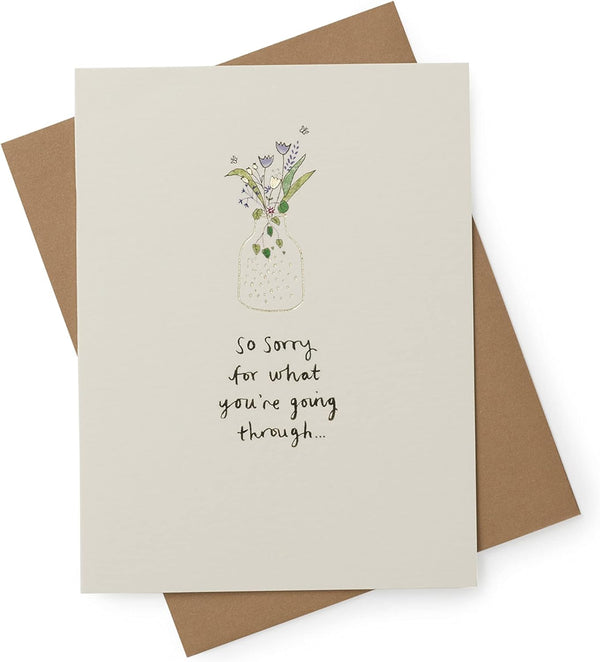 Elegant sympathy card by UK Greetings with comforting words and a delicate floral design for expressing condolences.