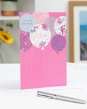 UK Greetings birthday card for mum featuring a stylish balloons design with colorful, festive illustrations.