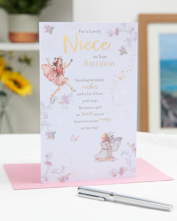 UK Greetings birthday card for niece featuring a whimsical fairies design, colorful illustration with cheerful fairy characters.