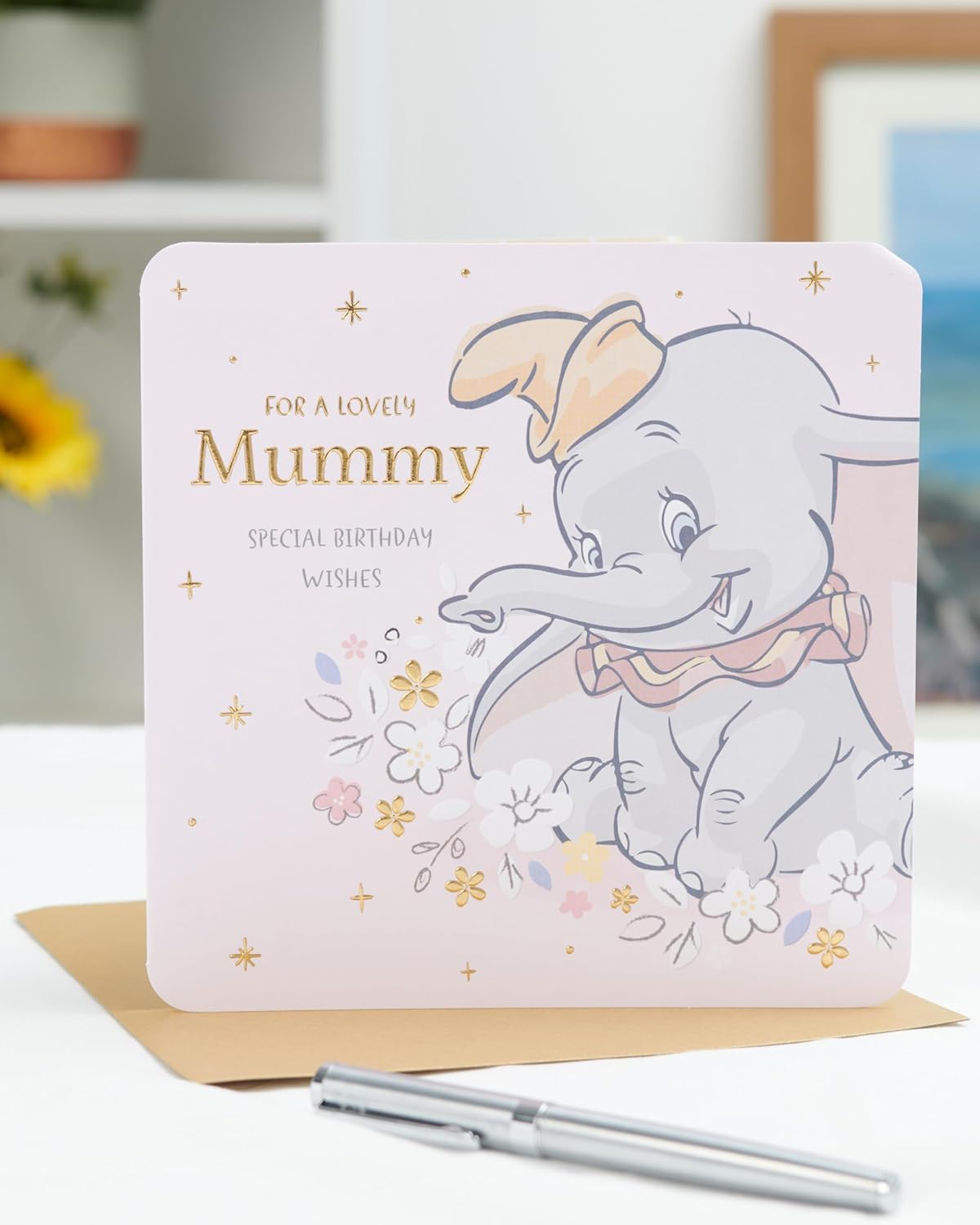 Disney Dumbo birthday card for Mummy by UK Greetings featuring a special wishes design with Dumbo and colorful birthday graphics.