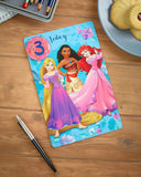 Disney Princesses 3rd birthday greeting card with badge featuring colorful princess illustrations and festive design.