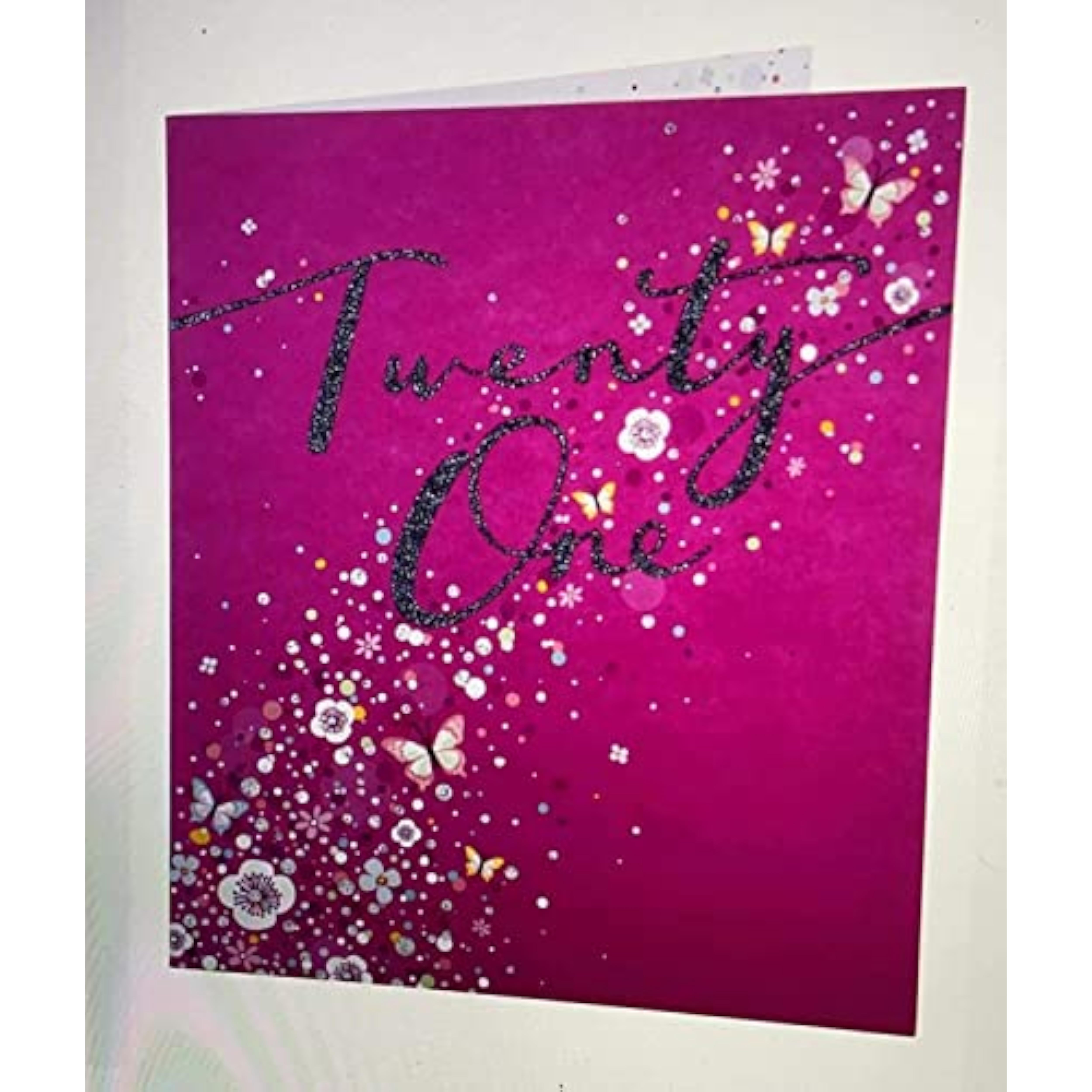 Pink flowers and butterflies greeting card for 21st birthday, featuring floral and butterfly illustrations on the front.