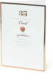 UK Greetings 35th wedding anniversary greeting card featuring a coral heart design with elegant decorative elements.